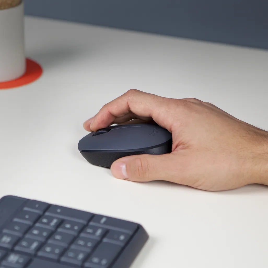 Logitech M170 Wireless Mouse in grey being used with a laptop for home or office computing