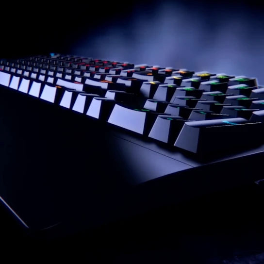 Person using Logitech G213 Prodigy RGB Gaming Keyboard for gaming on PC