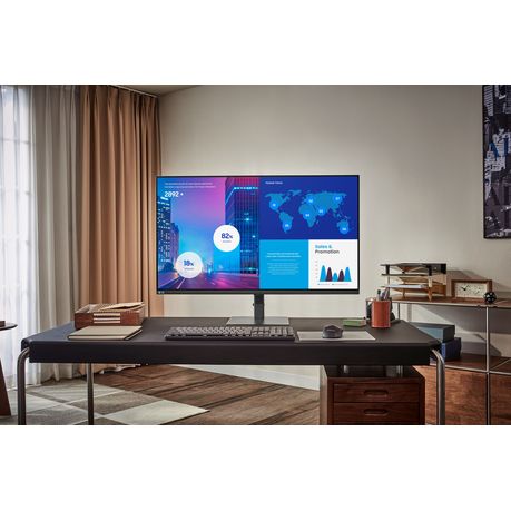 “Samsung 32-inch Smart Monitor – 4K UHD on office desk setup”