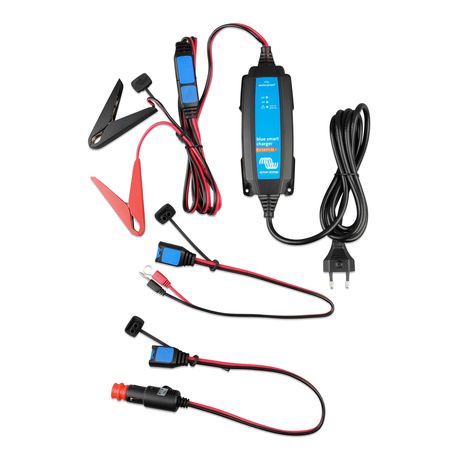 Front view of the Victron Blue Smart IP65 Charger 1.1A with attached power and output cables | Supplied crocodile clip (clamp connector) included with the Victron Blue Smart IP65 1.1A charger | M8 eyelet connector accessory for permanent battery connections.