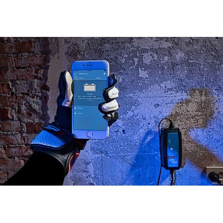 Victron Blue Smart IP65 Charger 12V 4A showing remote battery monitoring via VictronConnect app on iOS device |