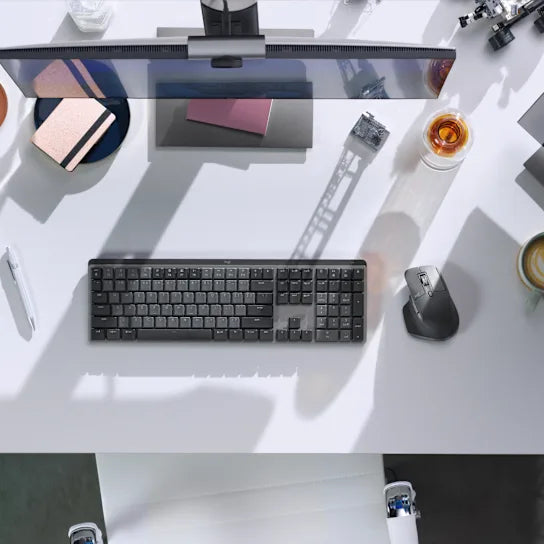 Logitech MX Master 3S mouse in graphite used with a laptop for professional workspace setup
