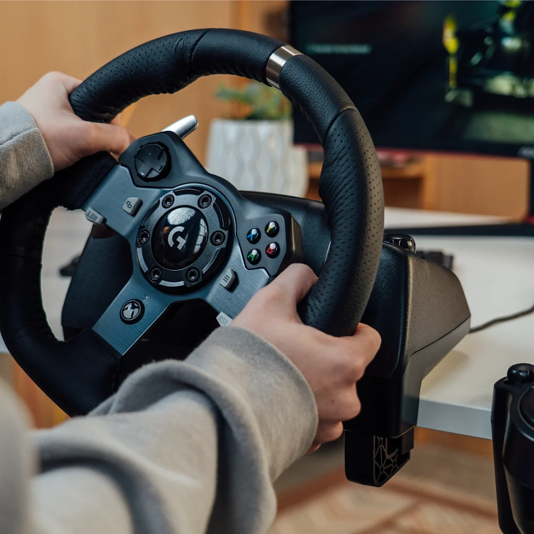Logitech G29 Driving Force Racing Wheel for PlayStation 4, PlayStation 3, and PC featuring realistic force feedback, stainless steel paddle shifters, and responsive pedals for an immersive racing experience.