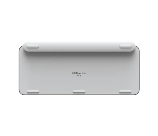 Side profile of Logitech MX Keys Mini keyboard in pale grey showing slim, low-profile keys and minimalist layout