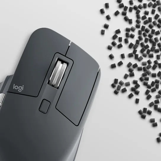 Logitech MX Master 3S mouse in graphite used with a laptop for professional workspace setup