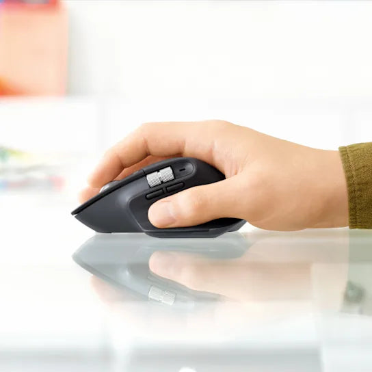 Logitech MX Master 3S mouse in graphite used with a laptop for professional workspace setup